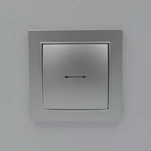 Выключатель Nilson Thor серебро 1кл с подсветкой ( 27131002 ) - фото №1